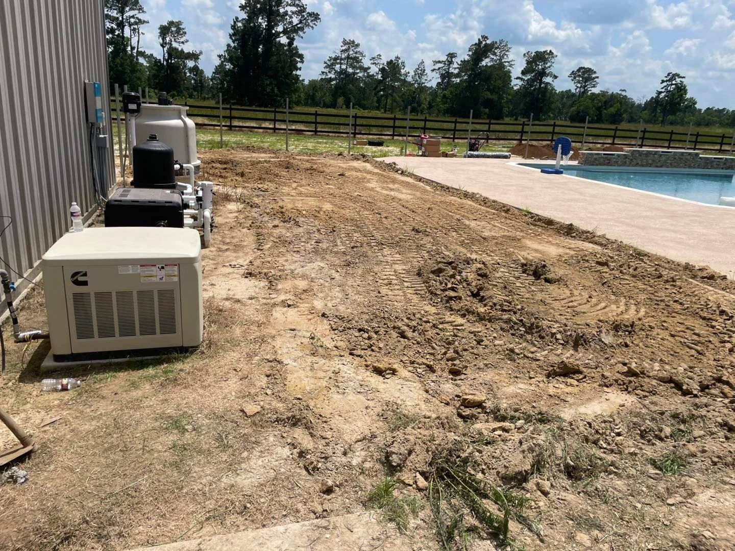 Pool area, bare dirt next to equipment