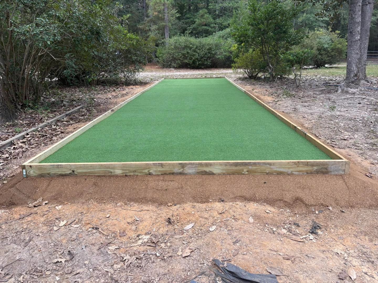 Custom bocce ball court with artificial turf surface